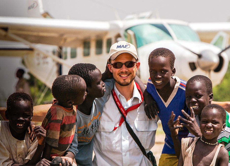 MAF plane, volunteer and child.